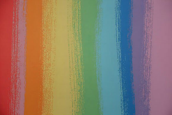 Unlock Creativity with Horizontal Rainbow Paint Dabs Background